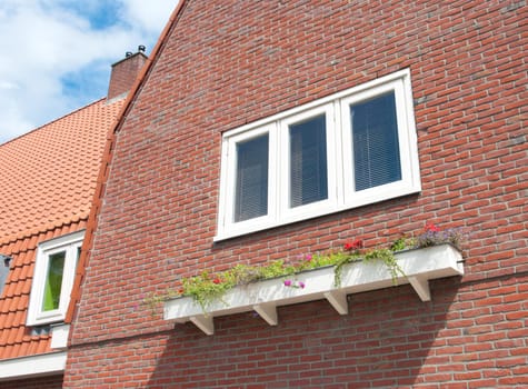 planter hanging on the side of a house
