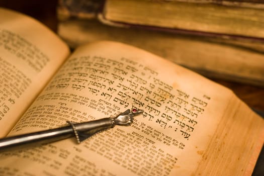 Old hebrew bible book and antique silver pointer.