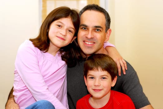 Portrait of a father with two children
