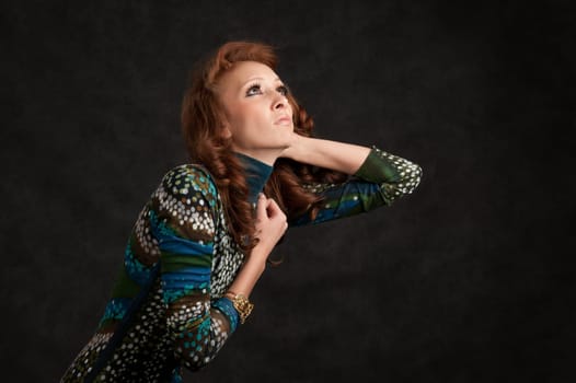 Portrait of a beautiful girl. Dark background