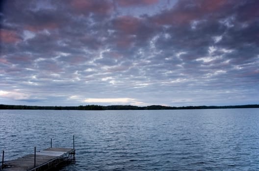 Dusk at the lake on a peaceful summer evening.