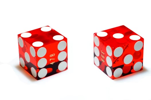 Real, red casino dice on a white background. Clipping path.