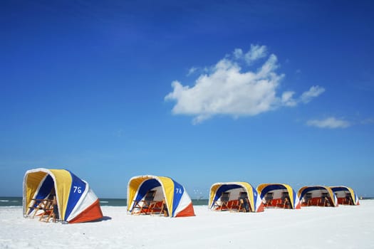 Colorful shelters on tropical beach