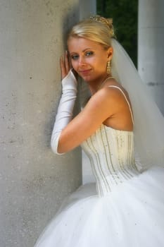 The beautiful bride at a column