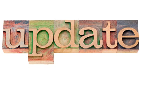 update - isolated word in vintage wood letterpress printing blocks
