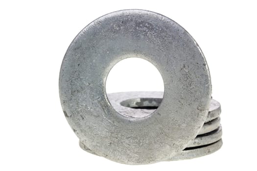 Flat metal washers isolated on a white background.