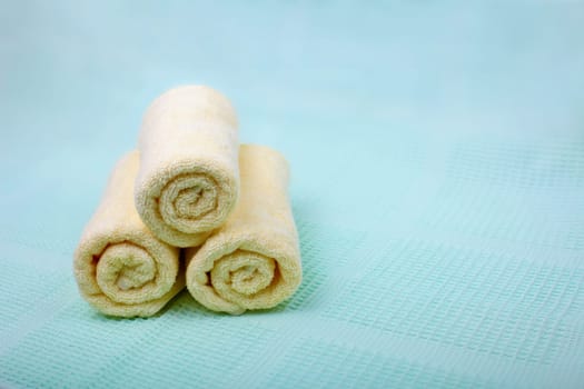 Ivory Spa towels on a blue background