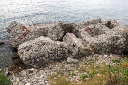 Fort Mezaluna Mesaluna Citadel Citadela Montenegro, Herceg Novi. The ruins of an ancient stone fortress, destroyed in an earthquake, fell into the Adriatic Sea, the Mediterranean. Tourist attractions