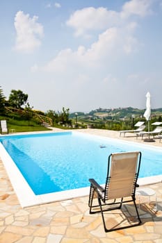 Swimming pool of an Italian beauty farm in the middle vineyards, Monferrato area, Piemonte region.