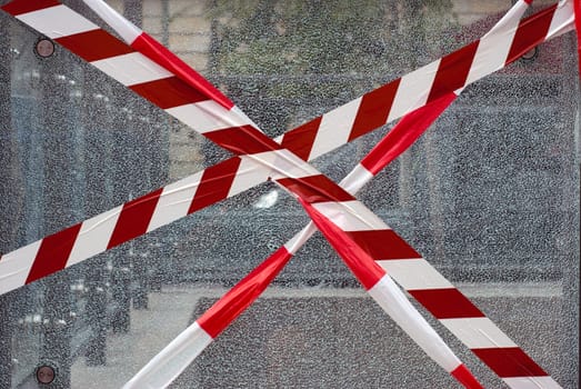 Broken glass with safety marking outdoors in Berlin, Germany.