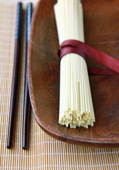 Japanese egg noodles on a wooden background