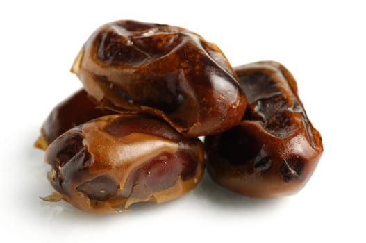 Dried Mazafati dates close-up Isolated over white background