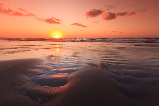 reflection of the sun at sunrise on sea