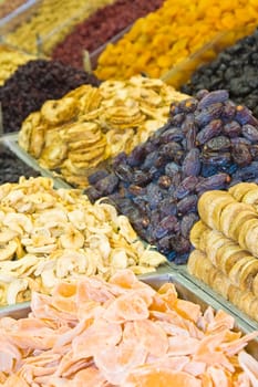 Colorful healthy dried fruits and dates in the market