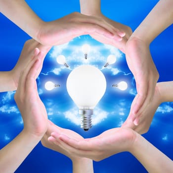 light bulb in women hand making a circle