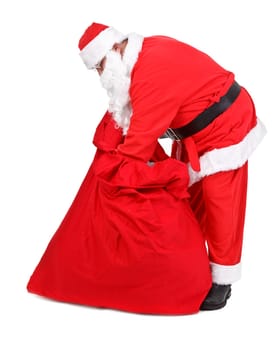 Santa Claus is looking for gifts on white background