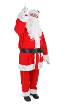 Santa is pointing his finger at an object above him