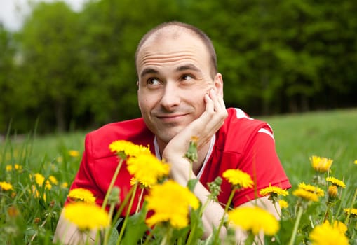 young man  on the grass