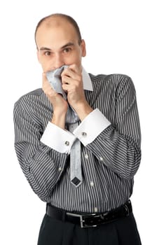 Worried business man holding his hands to mouth isolated on white background