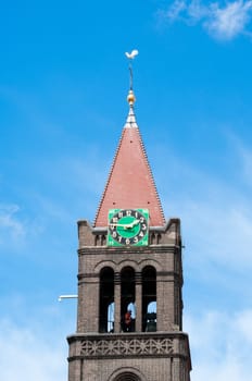 worker in clock tower of Maria-church in Enschede, netherlands