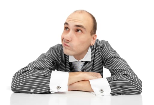 Portrait of handsome young thoughtful businessman