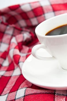 cup of coffee is on a white saucer