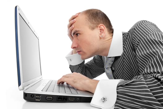Young businessman working with laptop