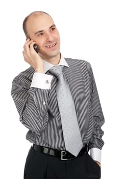 Portrait of young businessman talking on mobile phone. Isolated on white.