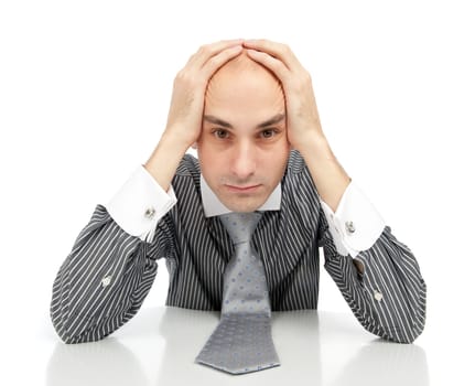 Young depressed businessman looking at the camera