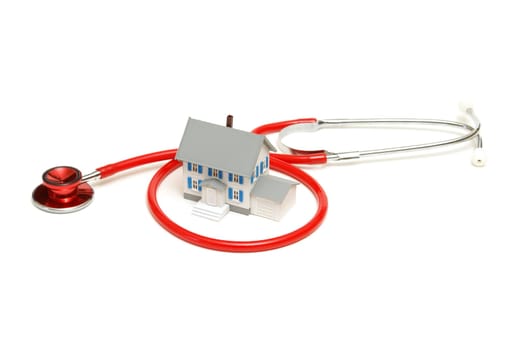 An isolated stethoscope and house represent home nursing or other concepts.