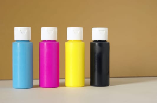 CMYK containers of paint for accurate color reproductions.