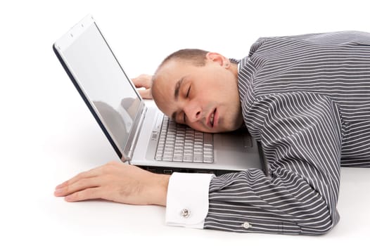 young businessman sleeping on laptop. isolated on white