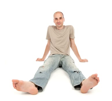 relaxed man sitting on the floor over white