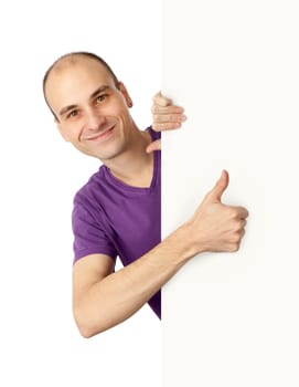 Man holding a vertical billboard and showing his thumb up