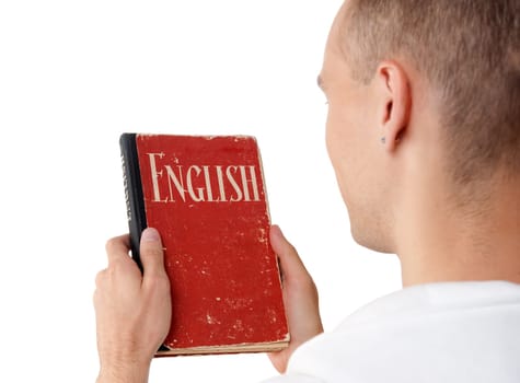 young man reading an English book. Rear view