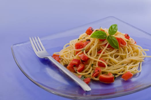 photo of delicious spaghetti with garlic and oil sauce on wooden table