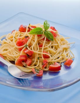 photo of delicious spaghetti with garlic and oil sauce on wooden table