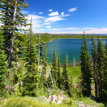 Beautiful blue waters Duck Lake in Yellowstone National Park of Wyoming, USA.