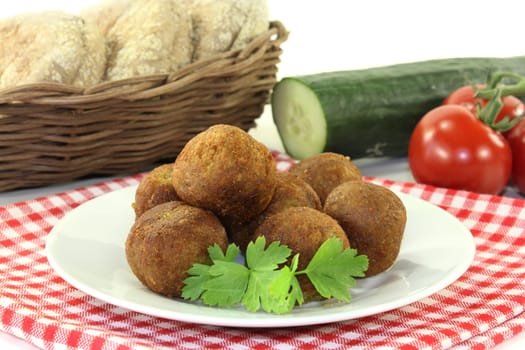 Falafel with fresh parsley against a bright background