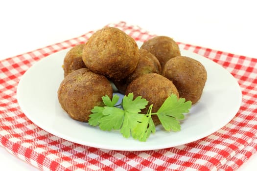 Falafel with fresh parsley against a bright background