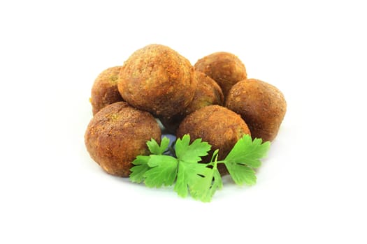 Falafel with fresh parsley against a bright background