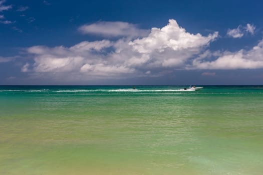 Beach on the tropical island. Clear blue water, blue sky. Beautiful vacation spot.