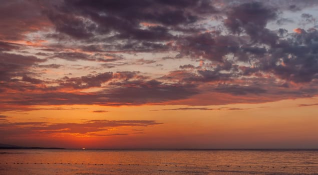 The beautiful red sunset at the beach.