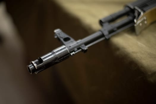 Barrel of machine gun. Russian weapons. Muzzle of firearm. Sight at muzzle.