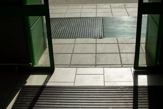 Doors open automatically. Opening door by motion sensor. Entrance to building. Login details.