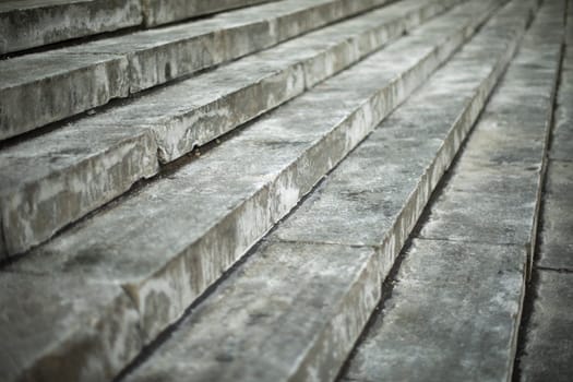 Steps on street. Architectural details. Dirty steps. Stone slabs.