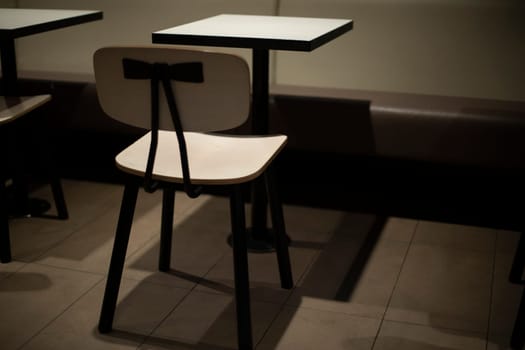 Table and chair. Interior with furniture. White small table. Seating area.