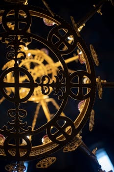 Ancient chandelier in Temple. Golden chandelier in church. Interior of beautiful building. Old design.