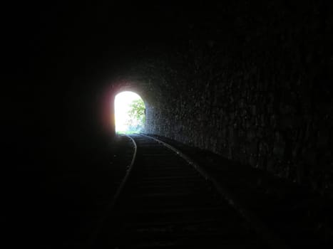 iron road bridges metal rail light at the end of the tunnel train transport