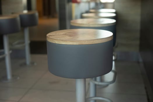 Round seat. Seating for visitors. Empty space. Bar.